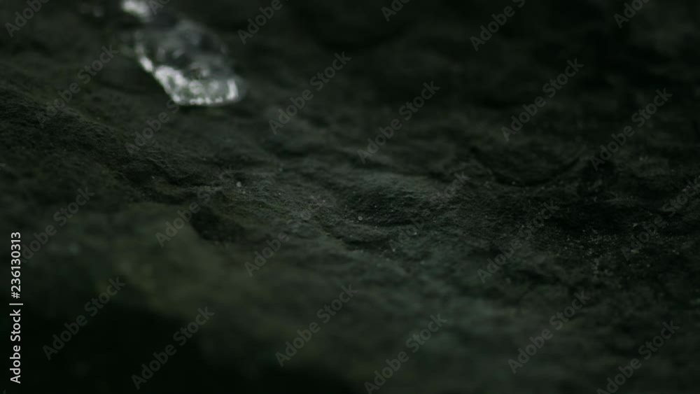 Rivulet of water running down a stone in slowmotion HD Rivulet of water running down a stone in slowmotion HD