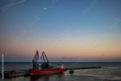 Transport ship getting loaded at Black Sea port photo