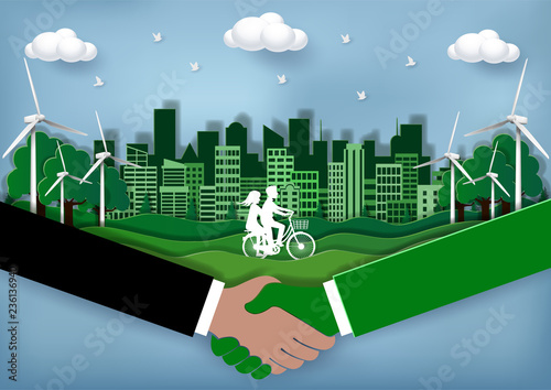 Eco city friendly Concept. Join hands with the environment to reduce global warming. Reduce pollution. Men and women are cycling in the lawn. Green town  Crafts & Paper Art