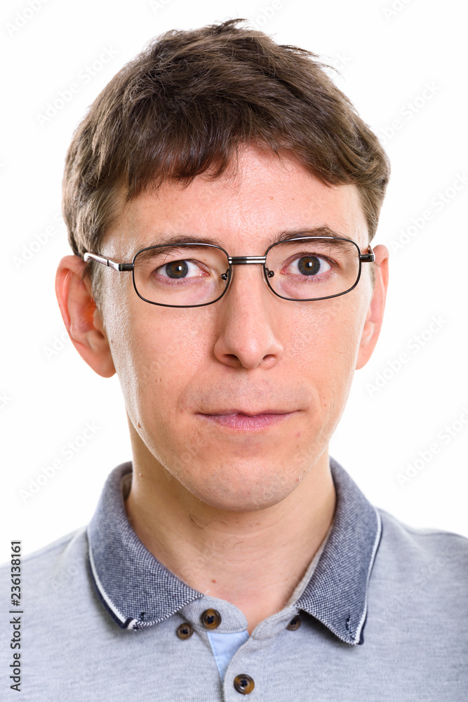 Face of Caucasian man wearing eyeglasses and looking at camera