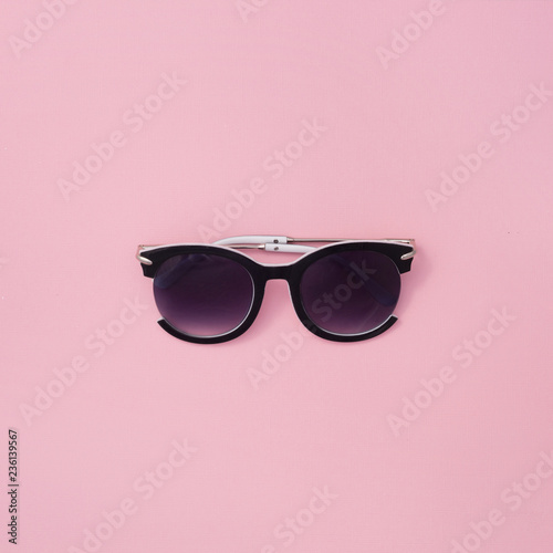 Sunglasses for women on a pink background. Square summer texture.