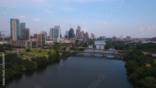 AERIAL: Drone pushing in and rising up on downtown Austin, Texas on a beautiful sunny day. photo