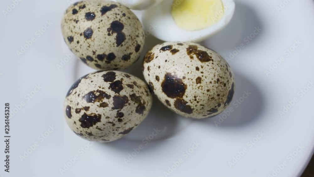 Uncooked scattered Quail eggs on white background top view, healthy food concept Uncooked scattered Quail eggs on white background top view, healthy food concept