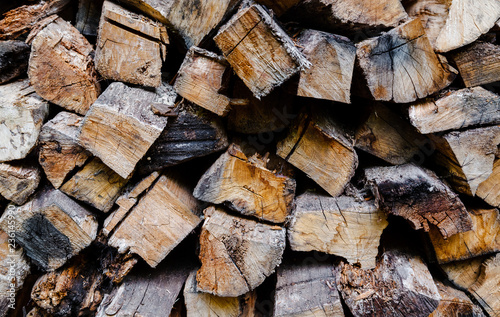 Firewood for the winter, stacks of firewood, pile of firewood.