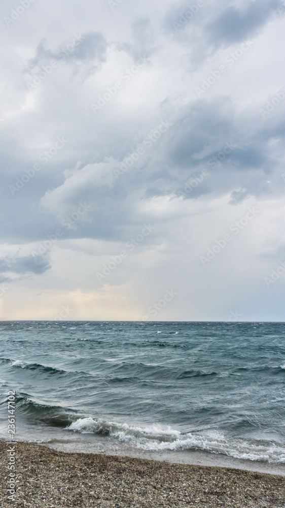 Sea water waves on cloudy day, nature background . Ocean view on cloudy summer day