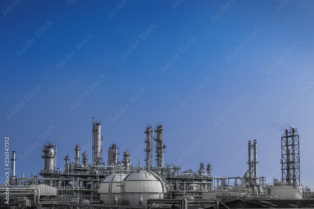 Manufacturing of petrochemical plant on blue sky background, Oil and gas refinery plant with storage sphere tank