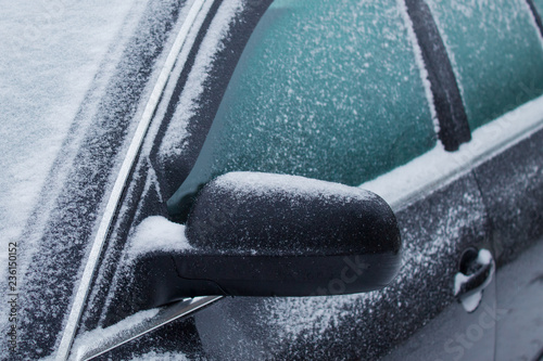 frozen car glass, car glass in ice with snow, frost, snowfall