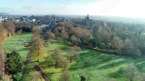 Low level aerial image of Pittencrieff Park in Dunfermline on an early winter’s day with hazy sunlight.
