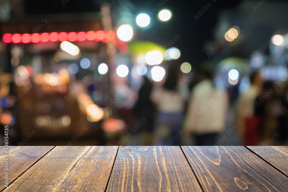 Empty wooden table of brown blurred background, colorful bokeh, presentation product