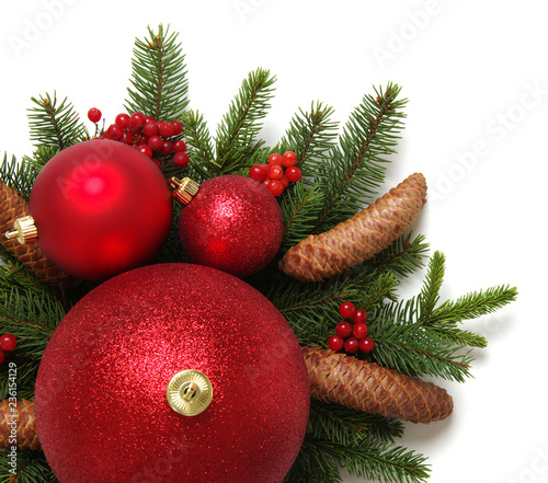 Christmas decoration: red balls with cones and fir tree branches