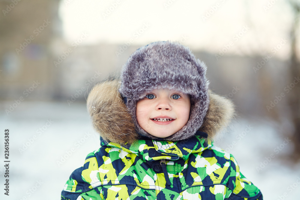 portrait of a funny little boy in the winter portrait of a funny little boy in the winter