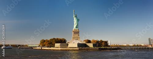 Panorama of island of Liberty with statue of Liberty seen from the ferry in the Hudson river.