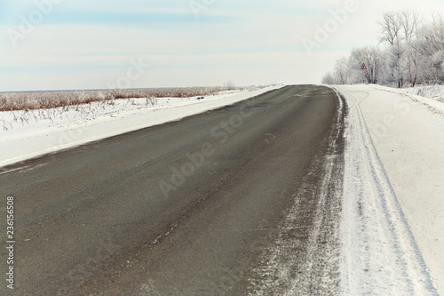 winter frozen asphalt road highway snow covered