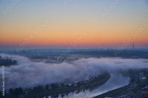 District Prague 6, Dejvice, with Vltava river a few minutes before sunrise with fog over the water during cold autumn day, Prague, capital of Czech Republic.  photo
