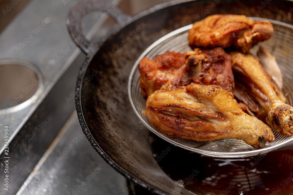Fried chicken in hot oil and boiling in pan Fried chicken in hot oil and boiling in pan
