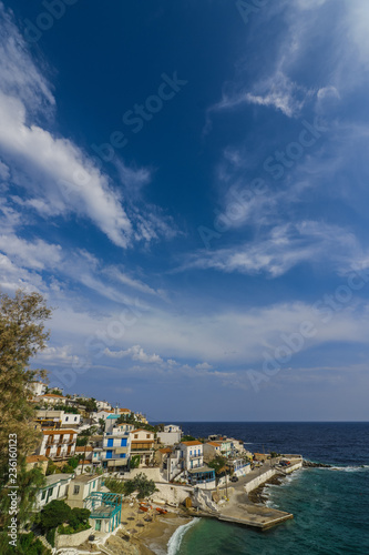 Fototapeta Naklejka Na Ścianę i Meble -  picturesque fishing village with traditional Greek houses and romantic harbor in the popular holiday destination Armenistis, Ikaria, Greece