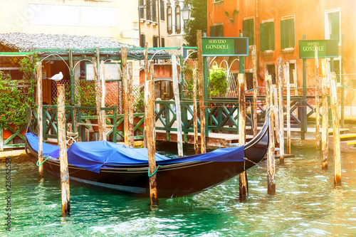 Canal with gondola in Venice with gondola service sign. Tourism concept in Europe