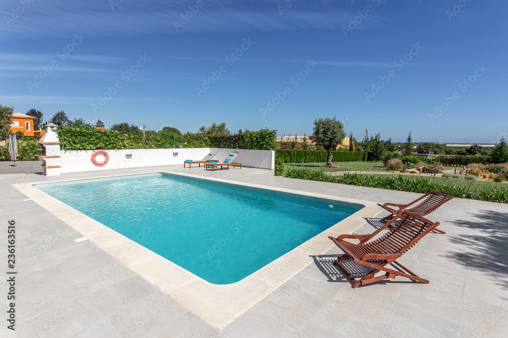 Sun bath with sun loungers and parasol. In Portugal. Sun bath with sun loungers and parasol. In Portugal.