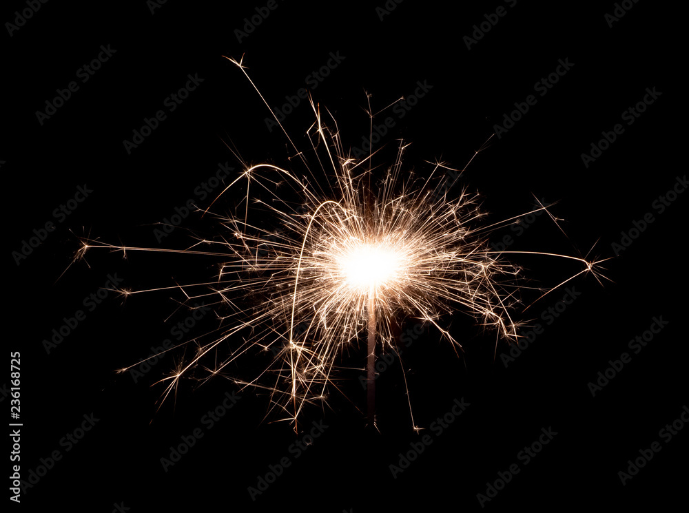 Obraz premium Bengal fire new year sparkler candle isolated on black background