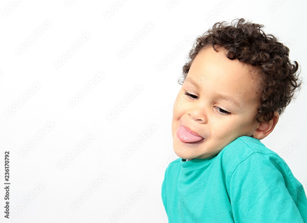 boy doing funny face and sticking his tongue out boy doing funny face and sticking his tongue out
