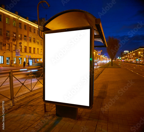 Billboard on the street Outdoor Advertising glows at night. Layout for  advertising design. Lightposter pylon with a white field. bus shelter Stock  Photo | Adobe Stock