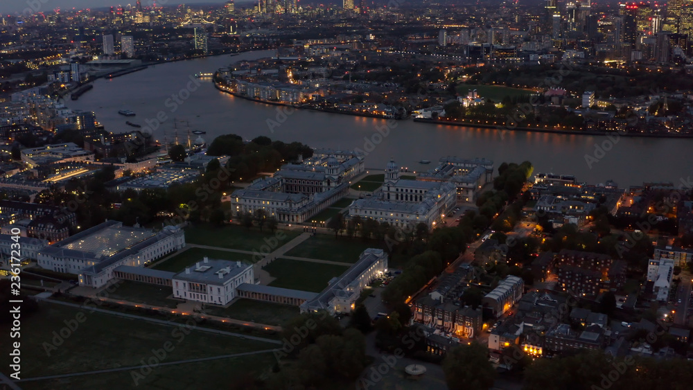 Aerial Night View University of Greenwich, Old Royal Naval College Historical Landmark, National Maritime Museum, Queen's House feat. River Thames, Isle of Dogs and Canary Wharf in London UK