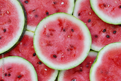 Circular Slices of watermelon as a background. photo