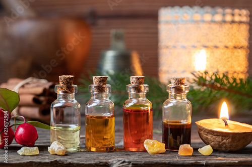 Christmas collection of essential oils with frankincense  wintergreen and candles