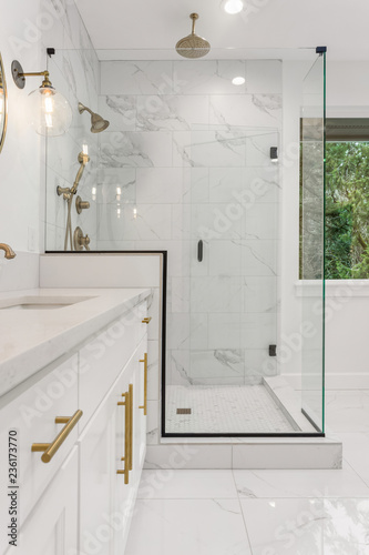 Bathroom Detail: Shower and Vanity in Ensuite Master Bathroom in New Luxury Home. Features Elegant Tile Floor