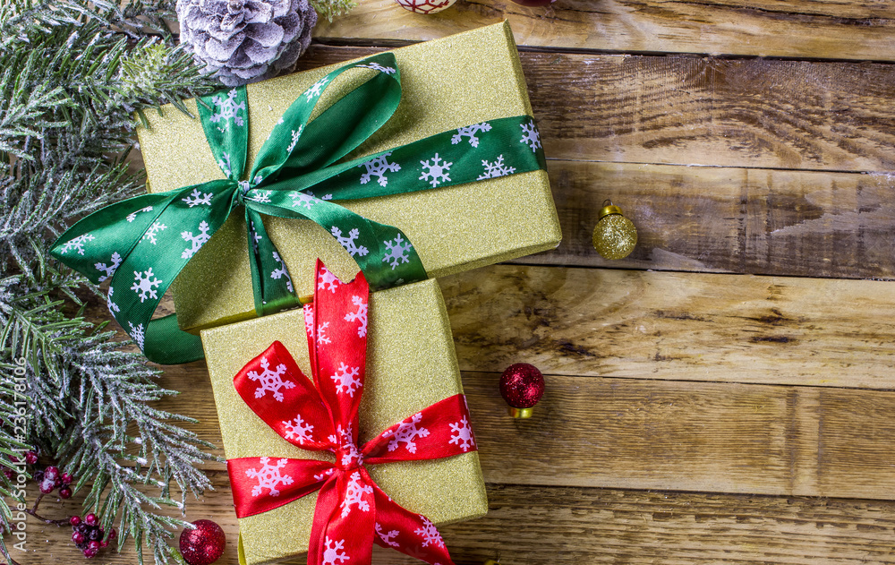 Christmas background with decorations and gift boxes on wooden background. Top view Christmas background with decorations and gift boxes on wooden background. Top view