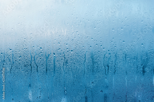 Condensation on the clear glass window. Water drops. Rain. Abstract background texture