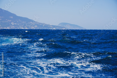 Yalta, Crimea, Russia. Black sea surface with white foam.