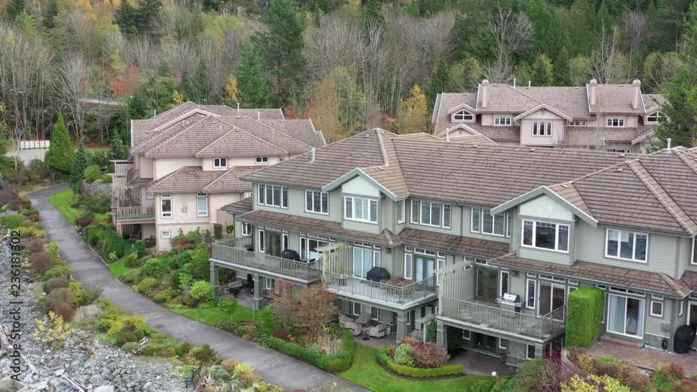 A perfect neighbourhood. Houses in suburb at Summer in the north America. Luxury houses with nice landscape. Aerial drone view. A perfect neighbourhood. Houses in suburb at Summer in the north America. Luxury houses with nice landscape. Aerial drone view.