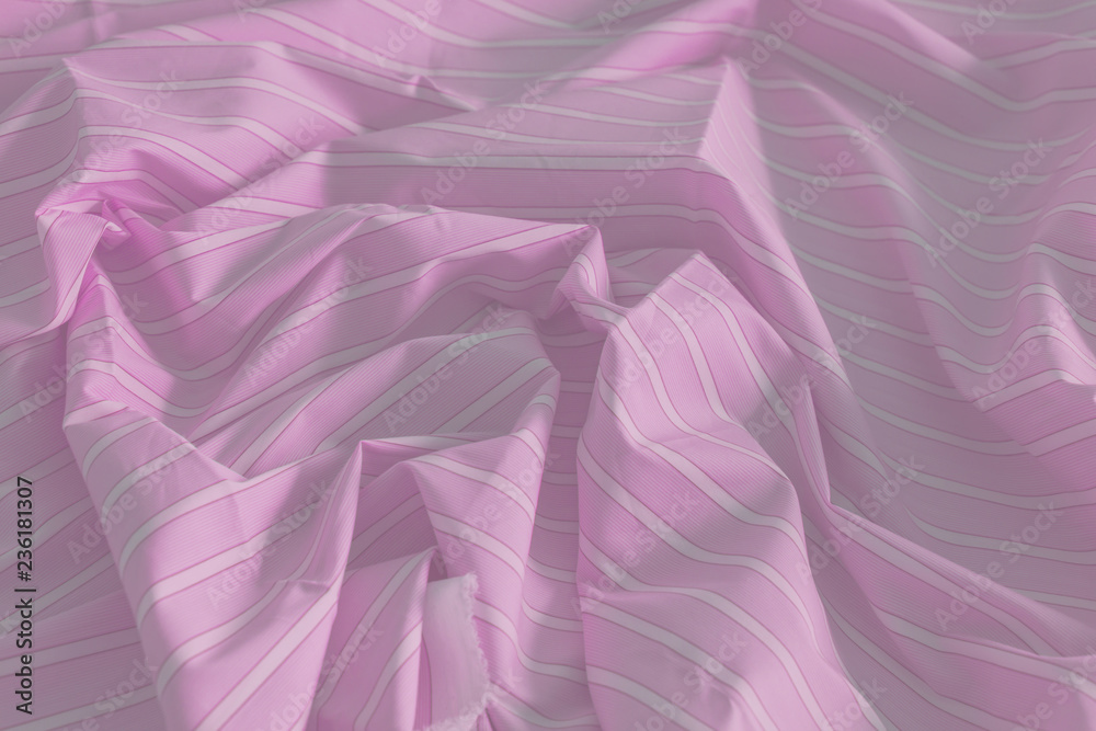 Close-up of smooth elegant satin texture of blue and white stripes. Cloth luxury background. Fashion Concept. Close-up of smooth elegant satin texture of blue and white stripes. Cloth luxury background. Fashion Concept.