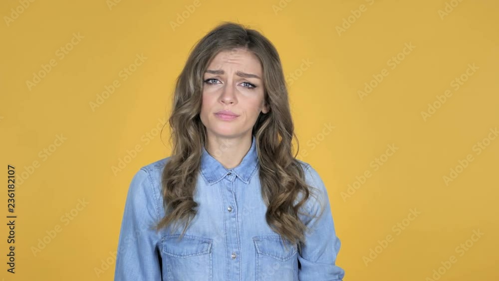 Surprised Young Girl in Shock Isolated on Yellow Background, wondering Surprised Young Girl in Shock Isolated on Yellow Background, wondering
