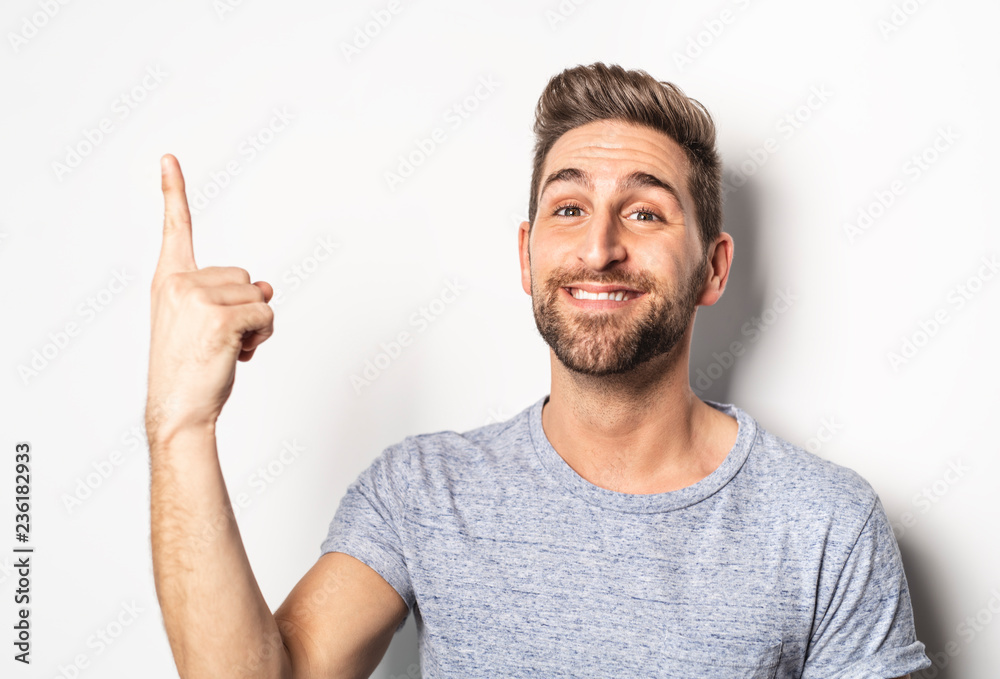 A nice guy in studio white, pointing something A nice guy in studio white, pointing something