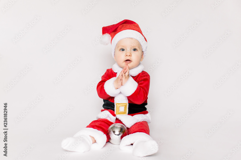 little Santa Claus sitting on the white background little Santa Claus sitting on the white background