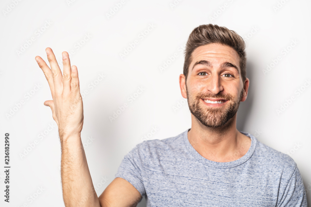 A nice guy in studio white, pointing something