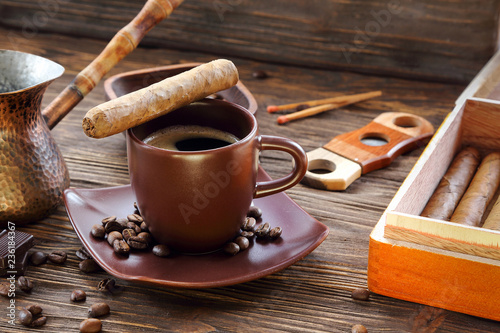 Cigars and a cup of black coffee