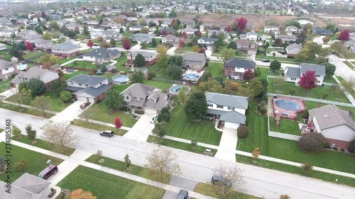 Overhead aerial view of residential houses and yards along suburban street - Travel and leisure concept