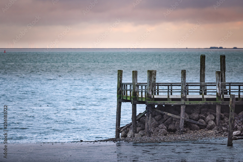 Pier at the beach of Wyk on the German Island of Foehr in cold November