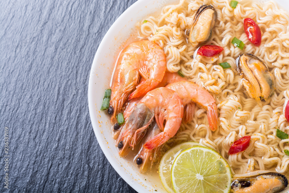Instant noodles soup with shrimps and mssels . Asian food Instant noodles soup with shrimps and mssels . Asian food