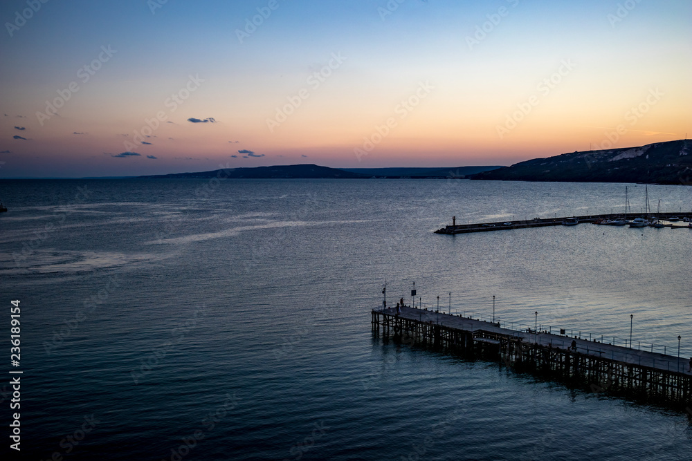 High view seascape towards Black Sea from the last story of the mill near the port at Balchik, Bulgaria, the blue hour right after sunset. Beautiful autumn landscape.