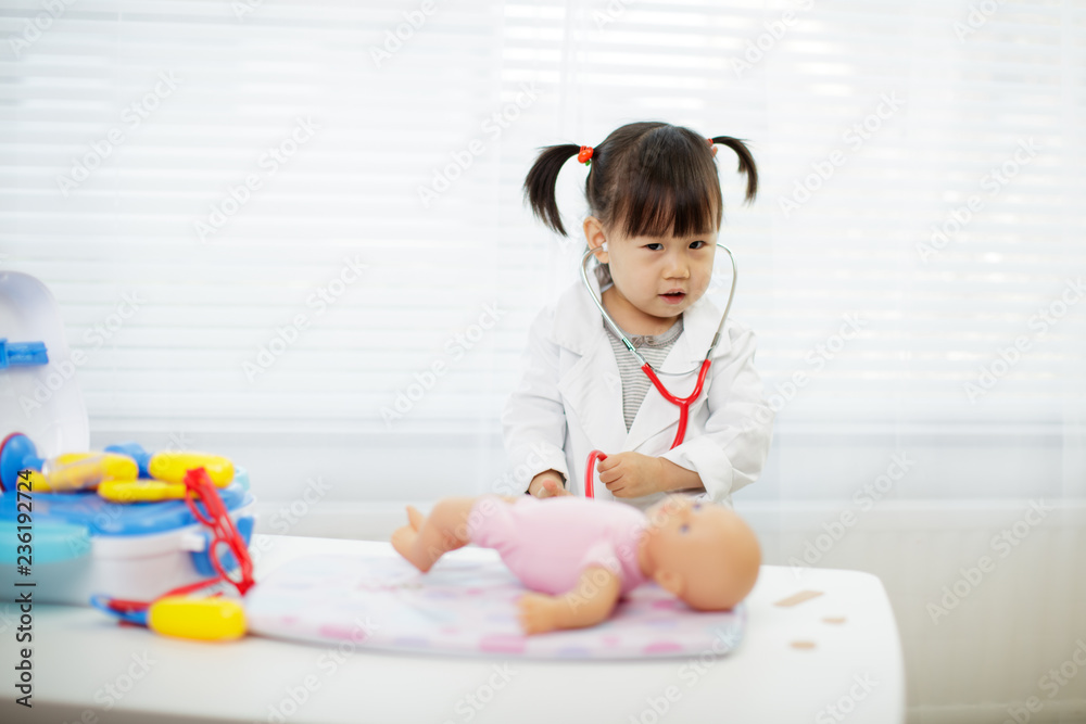 Toddler baby girl pretend playing as doctor at home Toddler baby girl pretend playing as doctor at home