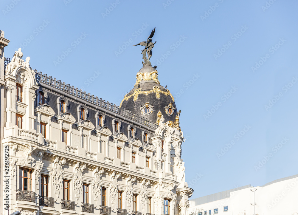 Upper part of a famous and classic building in the city of Madrid