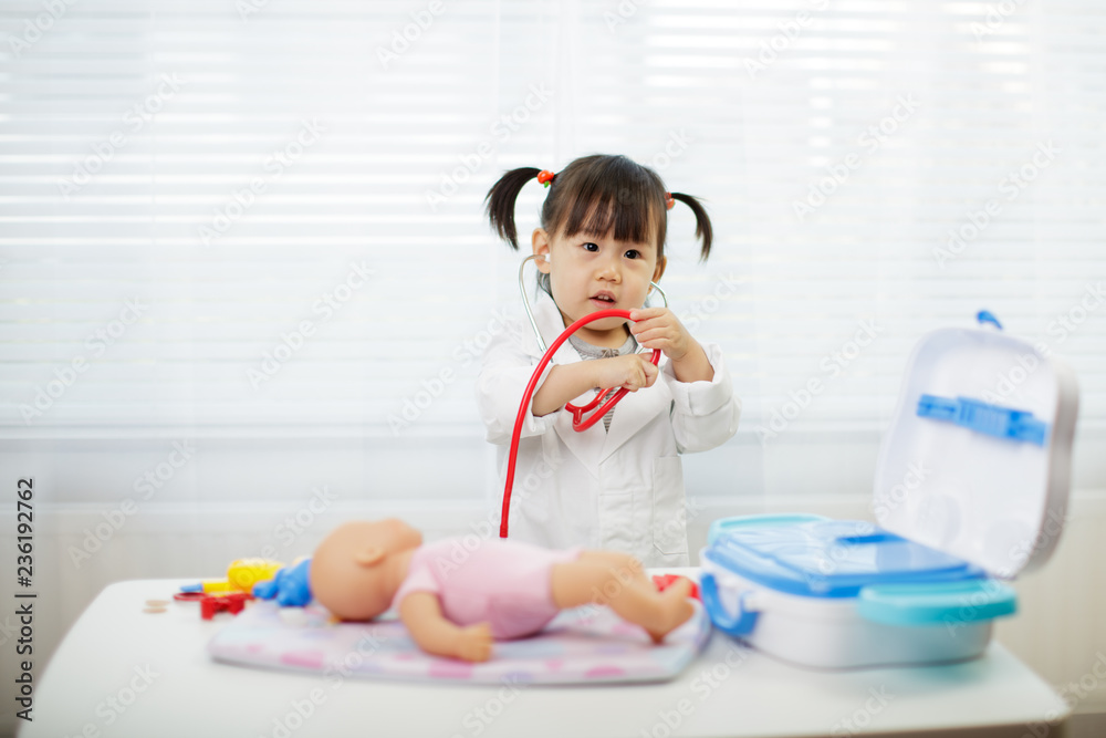 Toddler baby girl pretend playing as doctor at home Toddler baby girl pretend playing as doctor at home