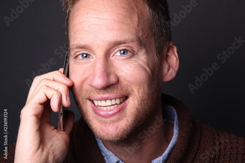 Portrait of a man in front of a colored background