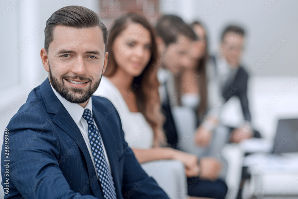 serious businessman on the background of the office serious businessman on the background of the office