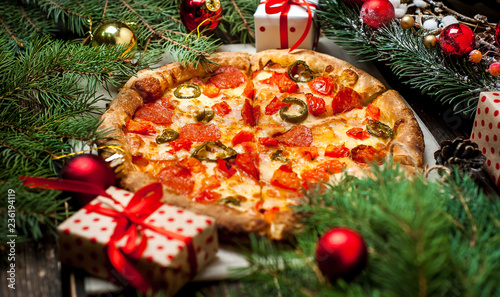 pizza on wood table with ingredients