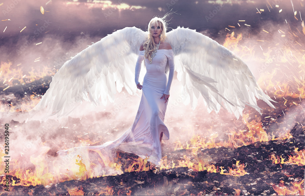 Fototapeta premium Conceptual portrait of an angel walking on hell flames
